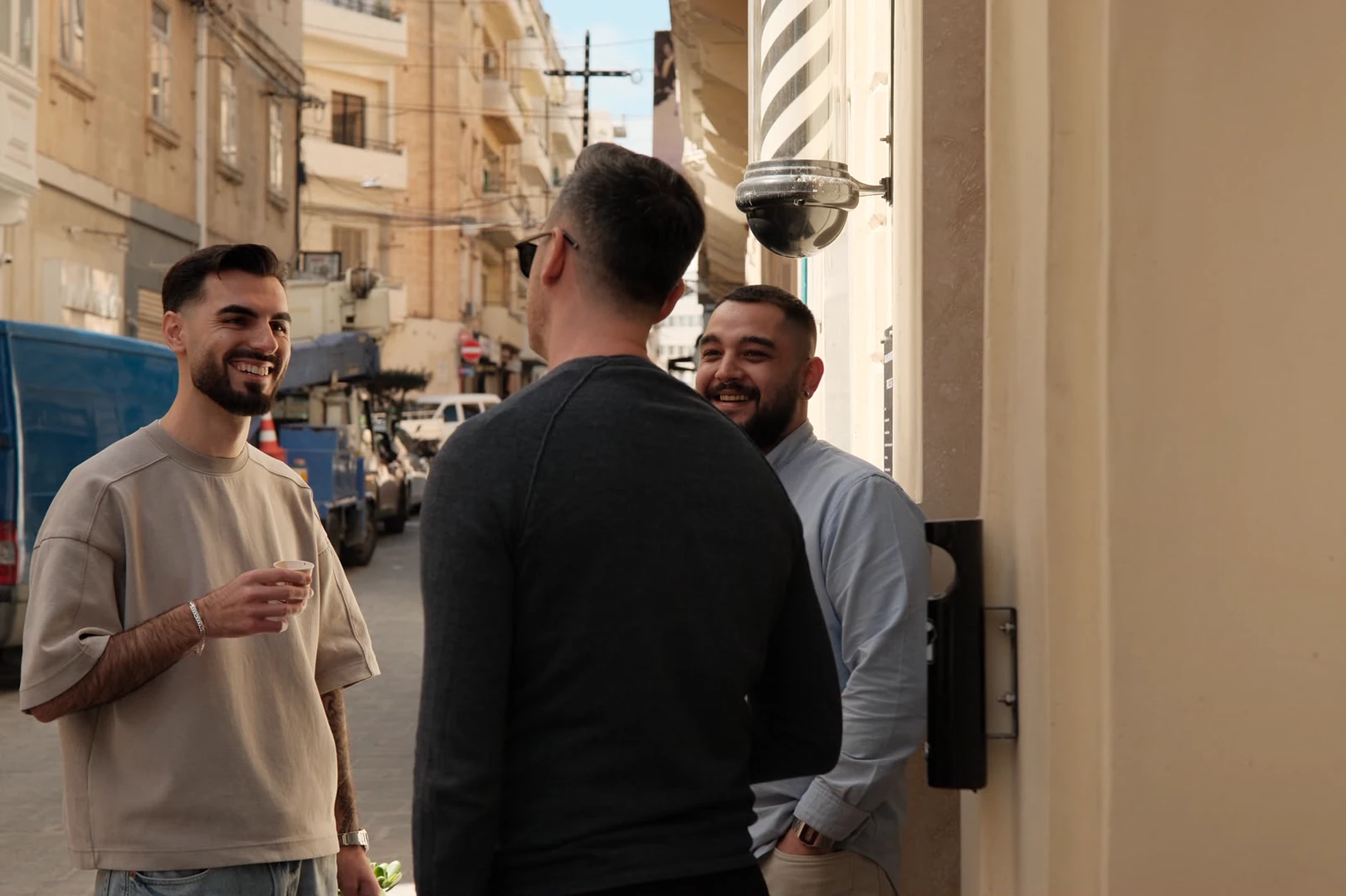 The founder sharing a laugh outside the studio on Triq Manoel De Vilhena.